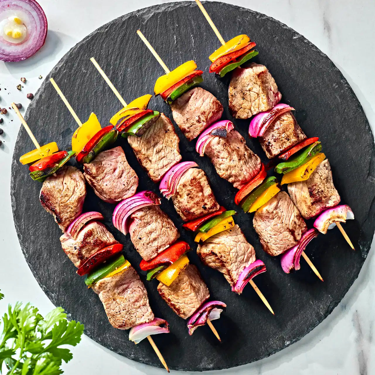 أوصال غنم ملح وفلفل - شراء لحوم طازجة في الرياض - أفضل ملحمة في الدمام - توصيل اللحوم الطازجة في الخبر - طلب لحوم عجل طازجة في الظهران - Meat and More-Lamb skewers served with roasted potatoes and yoghurt sauce